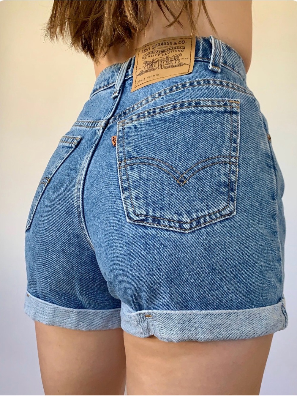 Vintage Levi's 954 Women's Medium Blue High-Rise Rolled Hem Denim Shorts